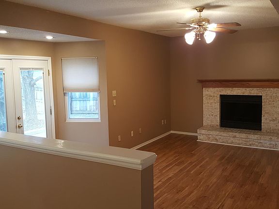 looking from kitchen into den - wood burning fireplace 
