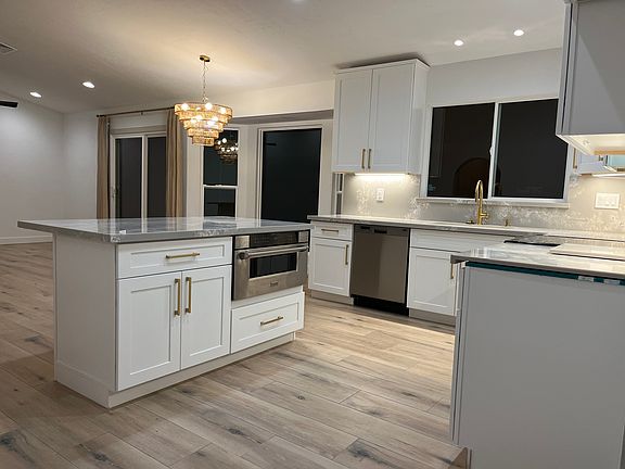 Separate island with seating for three comfortably. Added microwave drawer for an upgraded touch. Soft close drawers throughout the kitchen