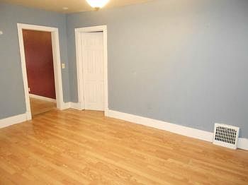 Living room is large with laminate floor and entries to the kitchen and master bedroom suite.