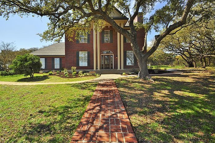 Gorgeous hill country home on 1.65 acre lots with towering oak trees.