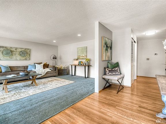 Entryway and front living room. Notice the beautiful hard wood floors! 