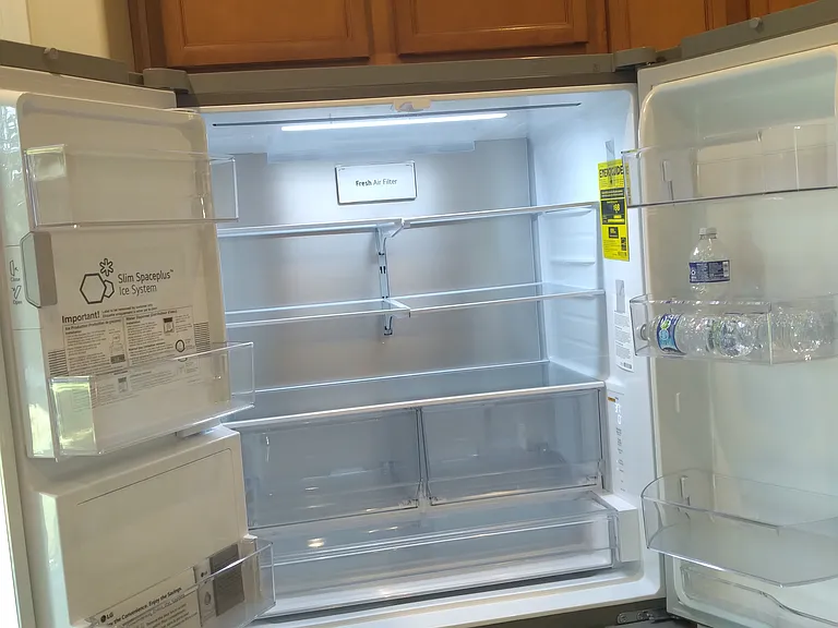 refrigerator freezer with 2 ice makers ice and water at door ,new