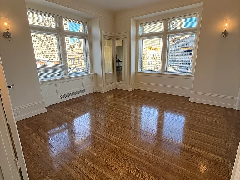 bedroom facing west and south with original built in double mirror
