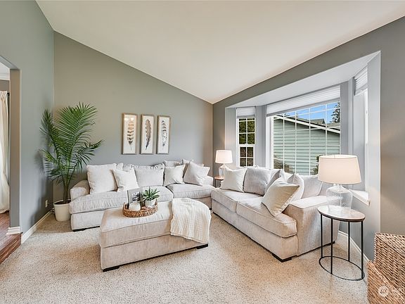Vaulted ceilings and Bay Window make this formal living room light & bright!>