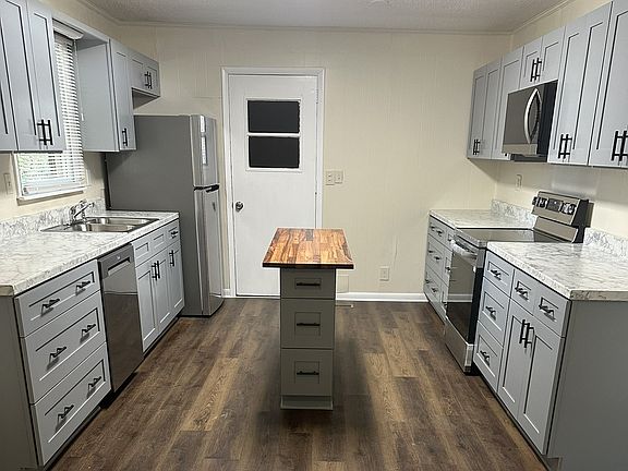 This beautifully and stunning redesigned, kitchen is complete with an abundance of brand-new cabinets, stylish countertops, and a suite of stainless steel appliances, including a refrigerator, stove, dishwasher and microwave.