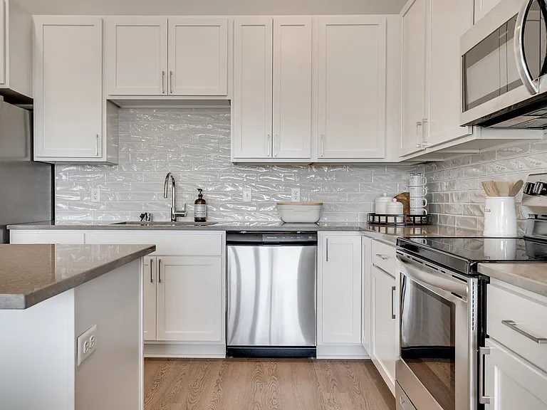Modern elegance meets practicality with sleek appliances and plenty of counter space.