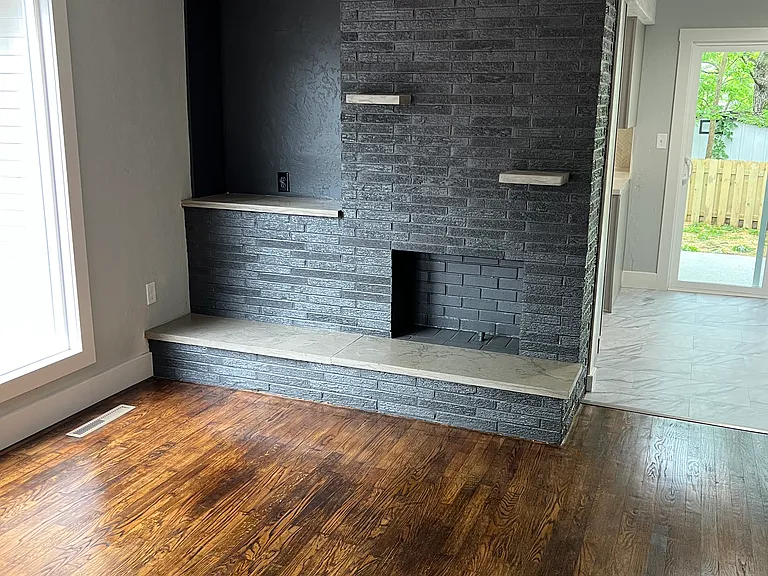 View from living room to dining room. (non-functional fireplace)