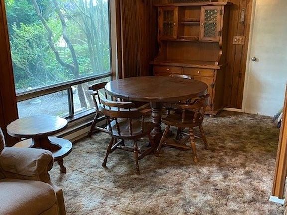 Expansive Windows provide light to the dining area adjoining the kitchen.