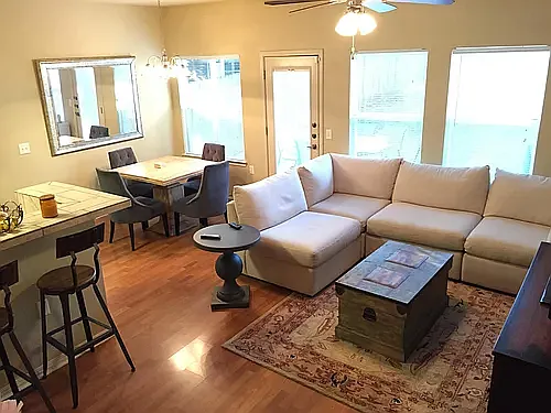 Living room with previous tenants' furnishings.