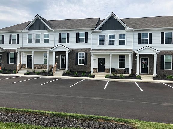 Unit 107 faces River Forest Drive. Second entry from left in this photo. Two assigned parking spaces in front of building.