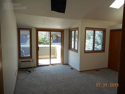Master bedroom with south facing and Flatirons vie