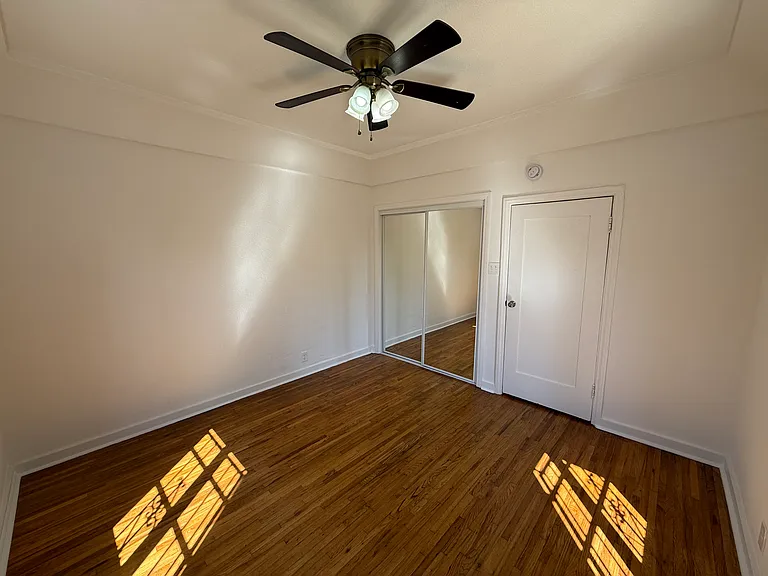 Primary Bedroom with Ceiling Fan Lighting