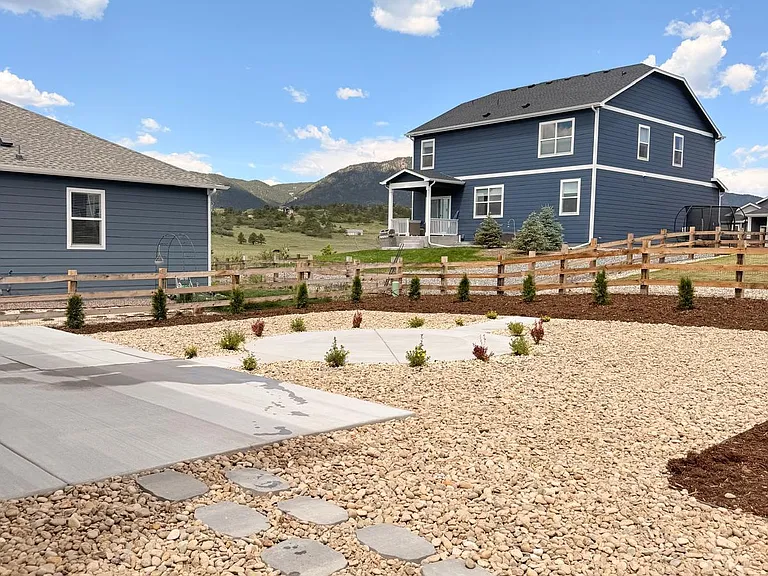 Backyard Patios with rocks, mulch and landscaping