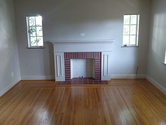 Living room with decorative fireplace.