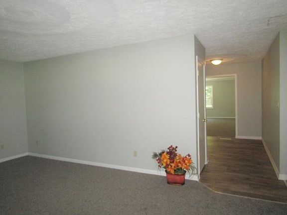 View from front door through dining area to recreational room.
