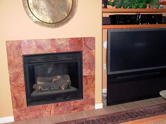 marble fire place, custom shelfing, 55 inch tv is included