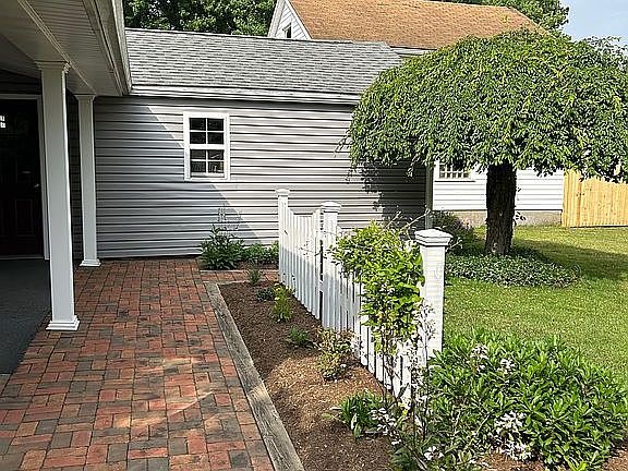 Brick patio off of porch