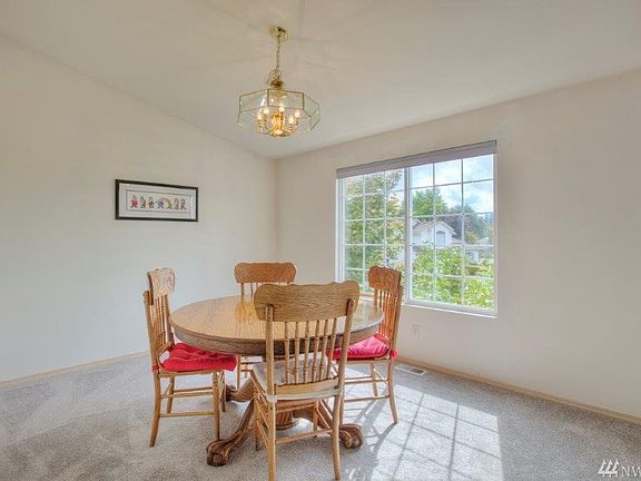 Separate formal dining room has a very dramatic feel from the vaulted ceilings. 