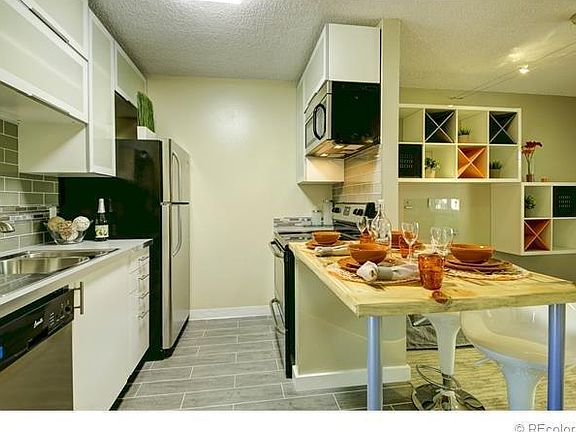 Kitchen has pots/pans, plates/cups/mugs etc