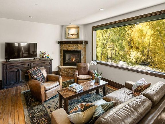 Living room overlooking the Roaring Fork River