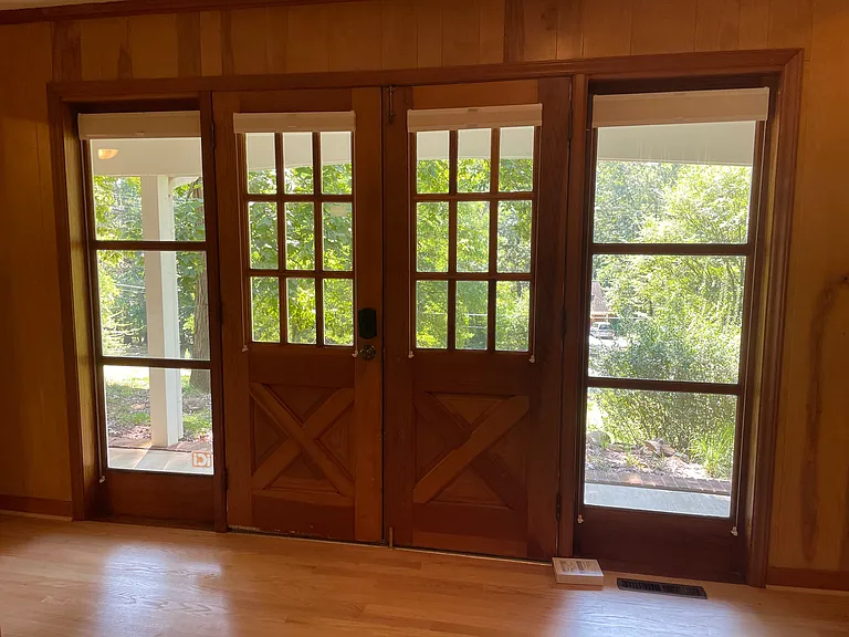 Front entry with bottom up/top down blinds for views and privacy.