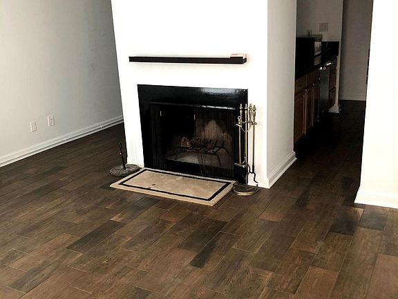 Cozy wood-burning fireplace in living room
