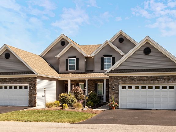 The Glennfield carriage home at Harvest Glen - two units building - two story home with front porch