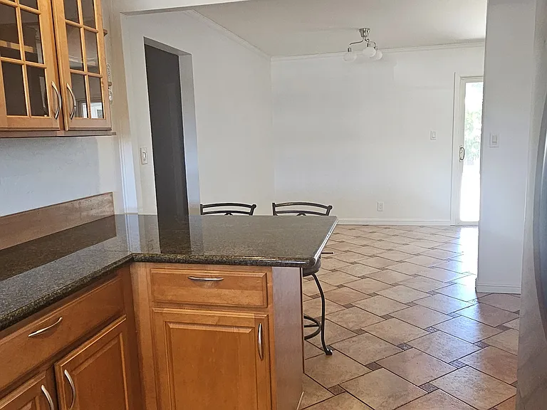 from kitchen view of the breakfast bar and the start of the dining room