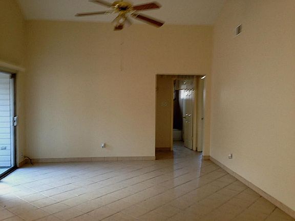 living area has fresh neutral paint, high ceilings and lots of natural light!