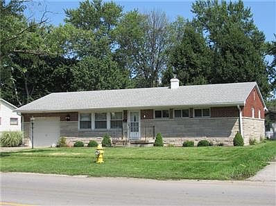 Solidly constructed brick and stone home with beautiful curb appeal.