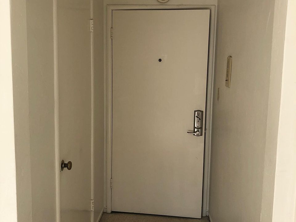 Looking back at front door and entry hall closet.