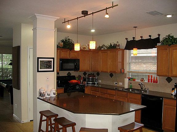 Next stop is the gorgeous kitchen with Silestone counters.  Perfect breakfast bar for a quick meal!