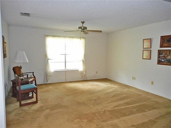 Living room with ceiling fan.