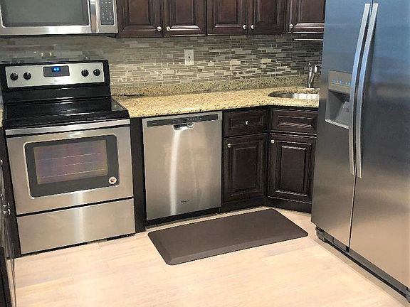 STAINLESS STEEL APPLIANCES - REFRIGERATOR, STOVE, DISHWASHER & MICROWAVE