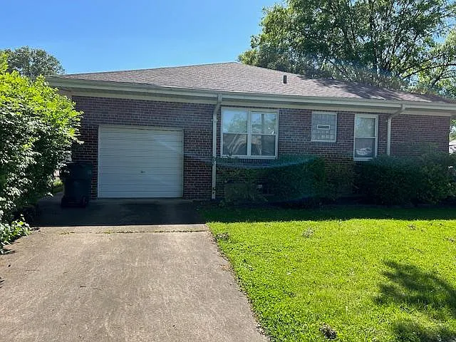Attached garage with new opener.