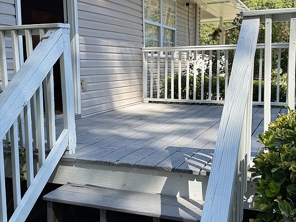 Side porch behind fence
