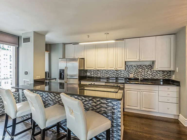 Kitchen with granite countertops and stainless steel appliances