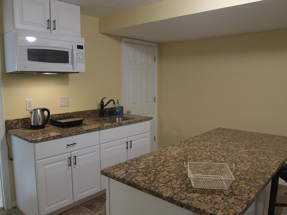 Kitchenette with microwave that doubles as a convection oven to bake/roast foods.