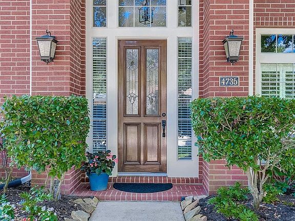 This stunning Perry home features a refurbished front door and plantation shutters...a welcoming entrance and just the beginning of your tour inside this amazing home.