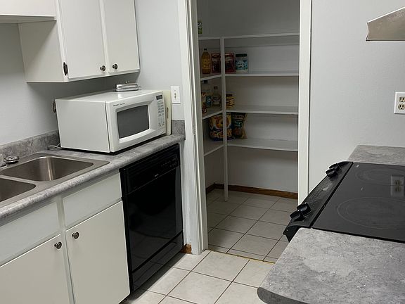 Kitchen with large pantry.