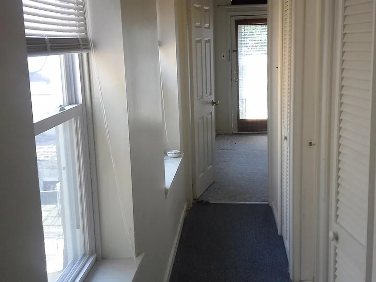 Hall to Bedroom with closet storage