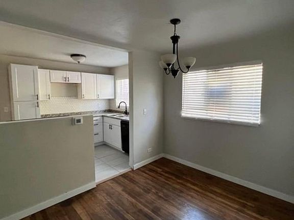 kitchen opens up to living room