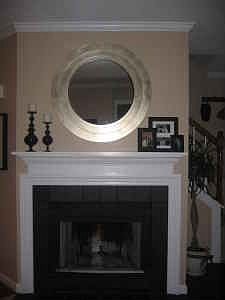 Wood-burning fireplace is focal point of living room