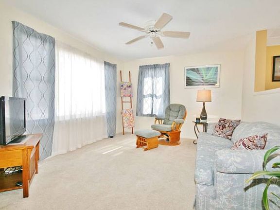 The family room opens to the kitchen and dining room area with a pass through that lets light fill the whole home. The large living room is a great place to sit and relax. 