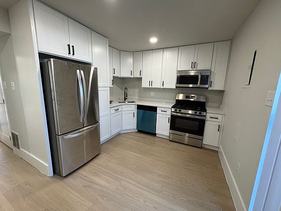Fully renovated kitchen with french door refrigerator.