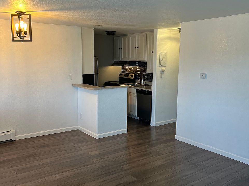 Large main room looking into kitchen