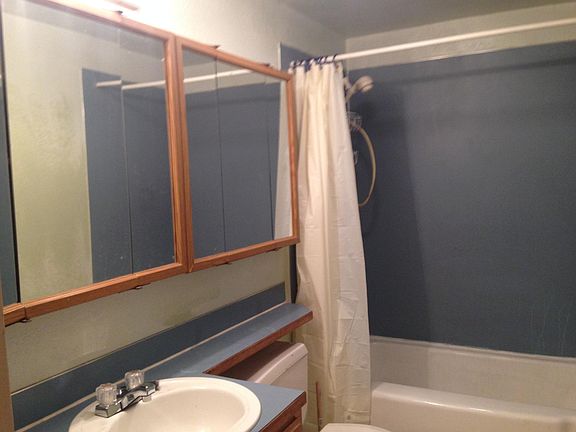 Full bath with mirror cabinets