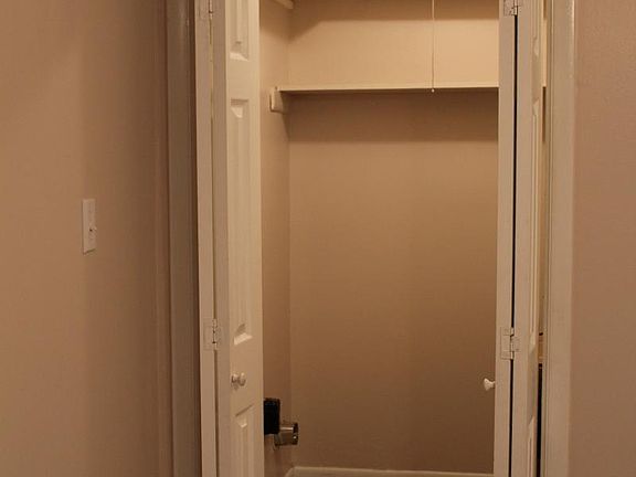 large indoor laundry area with lots of shelving