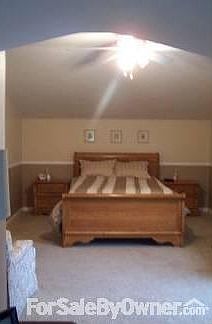 Upstairs master bedroom : Large, dormered master bedroom with walk in closet, window cutouts and sto