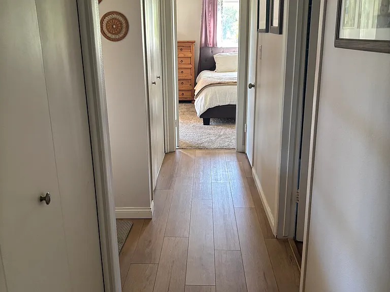 Hall to 3 bedrooms and 2 bathrooms